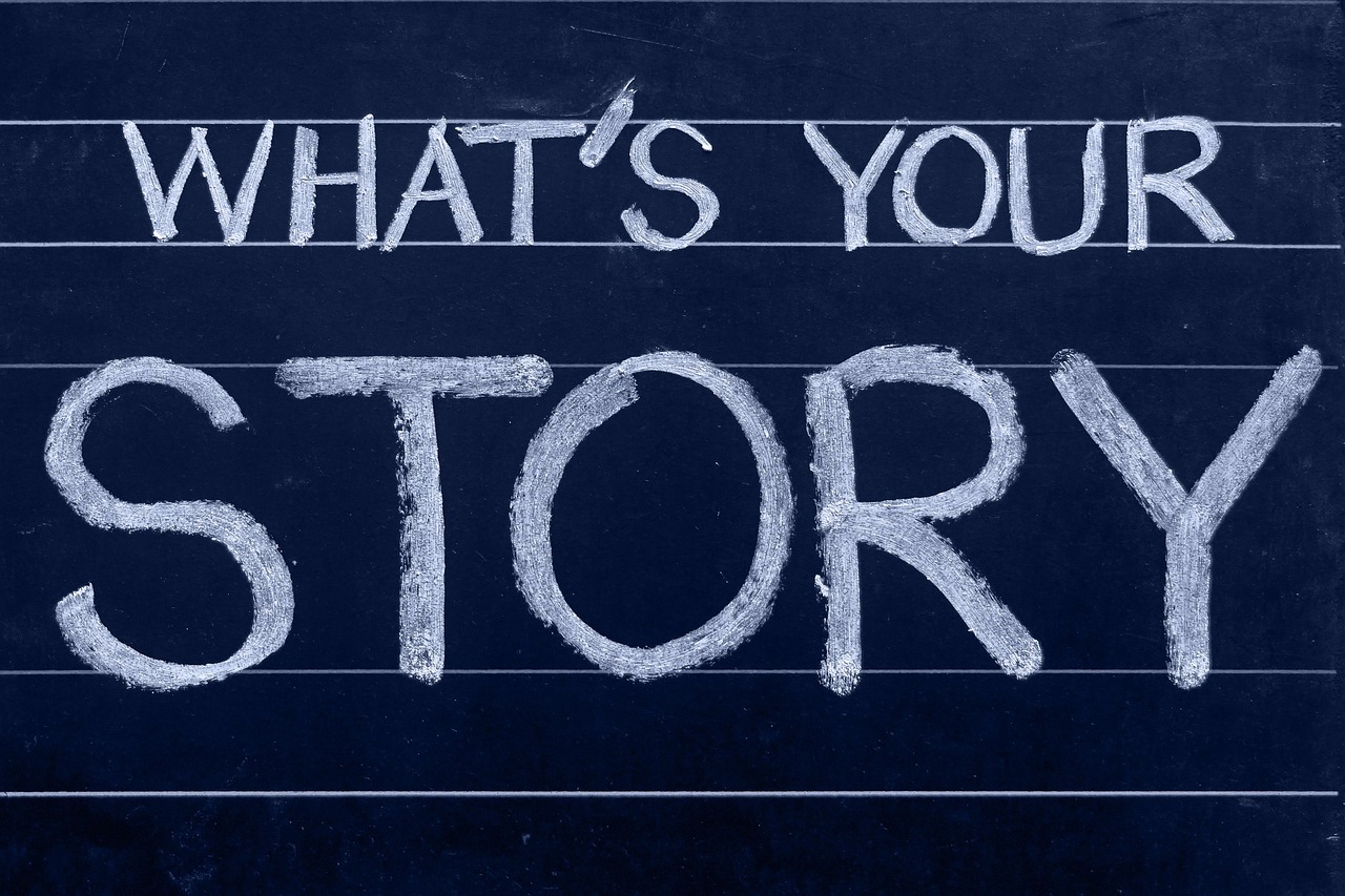 Chalkboard with &ldquo;WHAT&rsquo;S YOUR STORY&rdquo; written in white chalk.