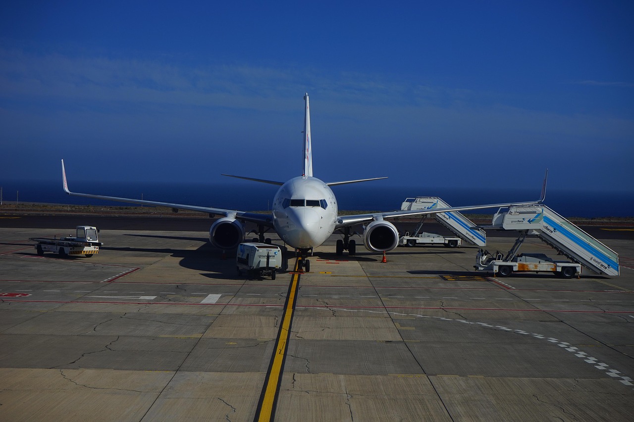 Canada eTA for Spanish Citizens: Requirements, Cost and How to Apply: aircraft parked on the tarmac at a Canary Islands airport with the ocean behind it