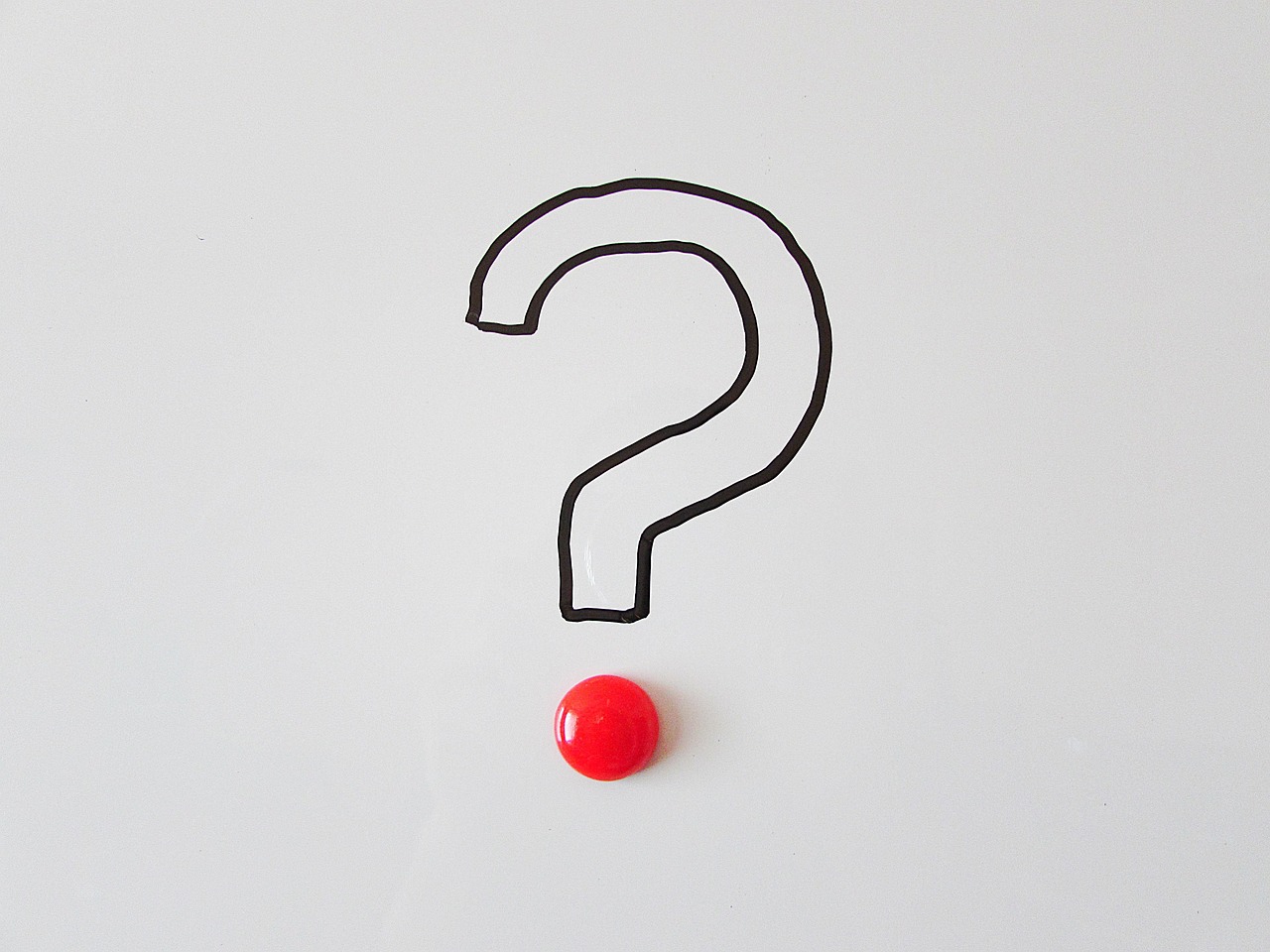 A hand-drawn question mark with a red dot on a white background.