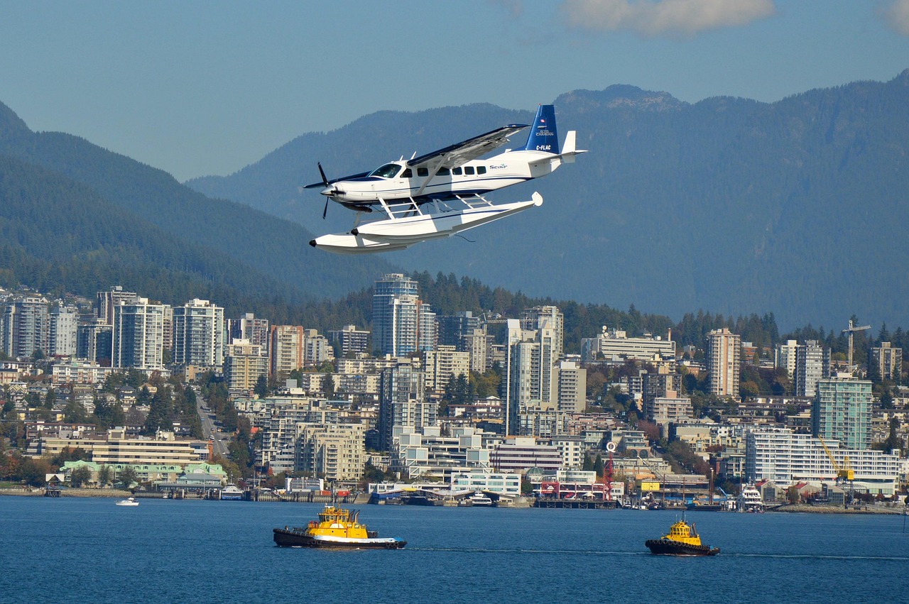 Arriving at Vancouver airport with an eTA: a floatplane over the harbour with the city and North Shore mountains behind